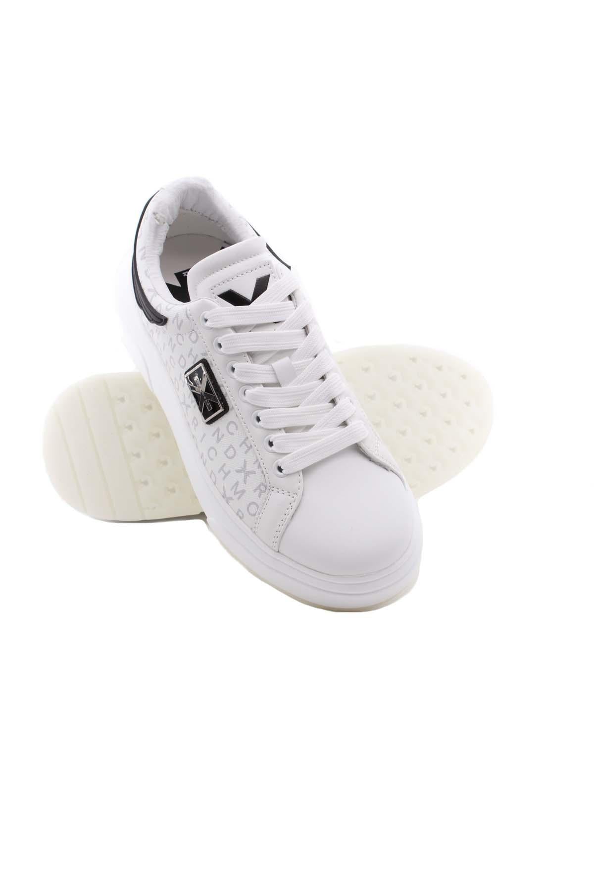 Sneaker in pelle con monogramma John Richmond