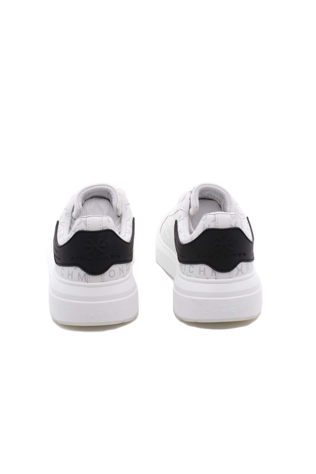Sneaker in pelle con monogramma John Richmond