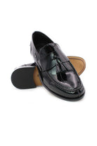 Mocassini in vernice con nappine 