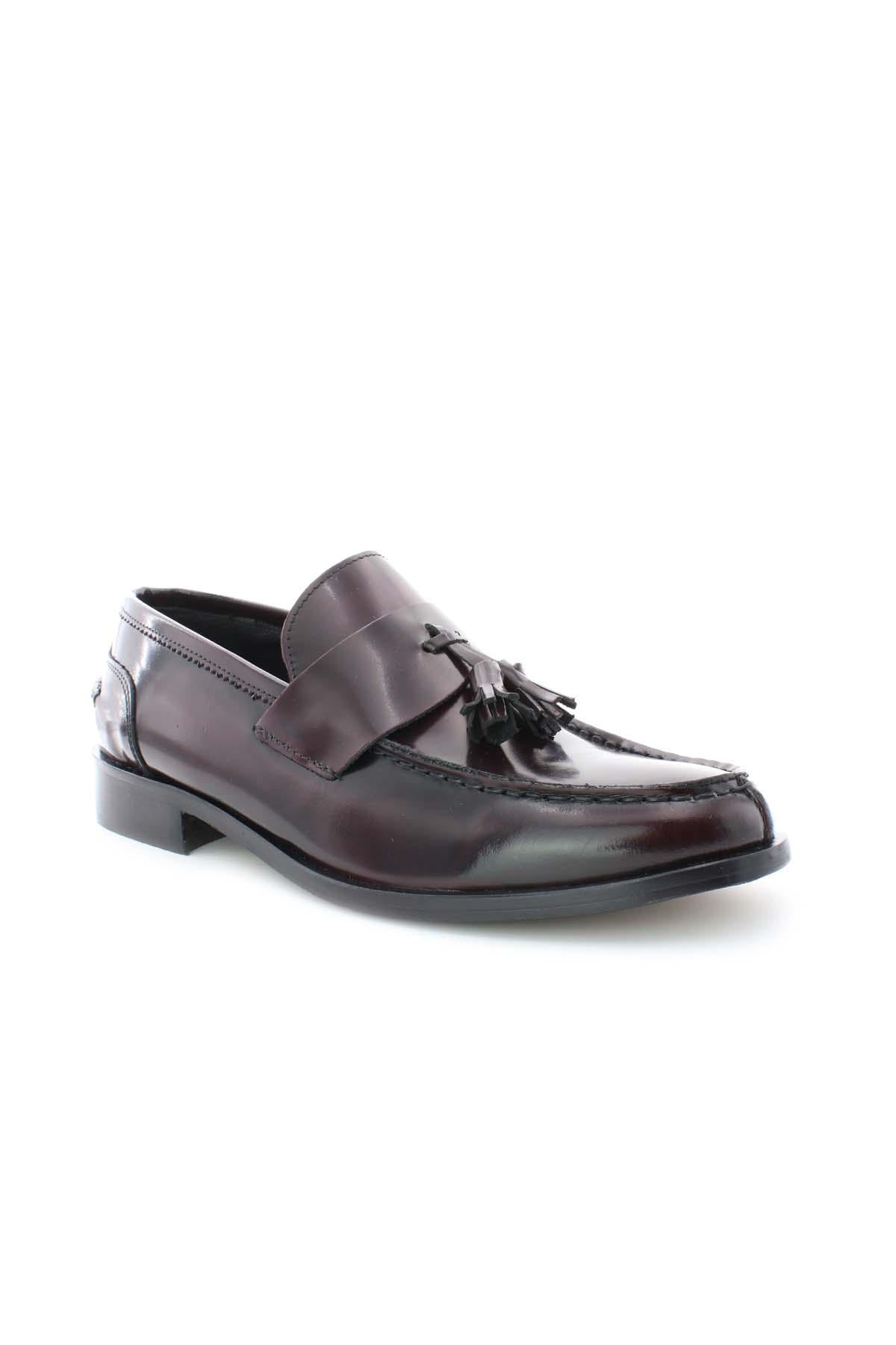 Mocassini in pelle con nappine 